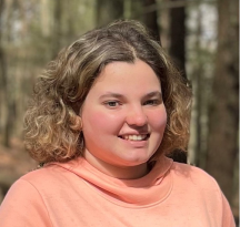 A female teenager smiling